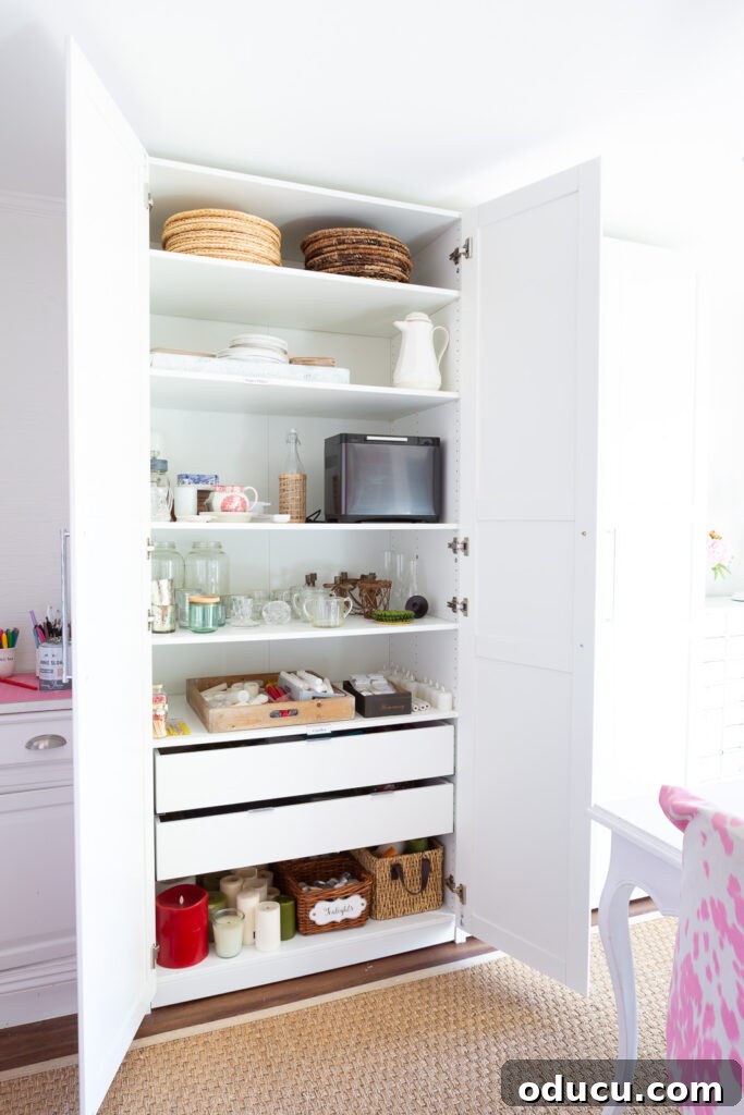 From Spare to Stellar: Room Transformation 7 IKEA PAX storage closet in white fitted with shelves and 2 drawers.