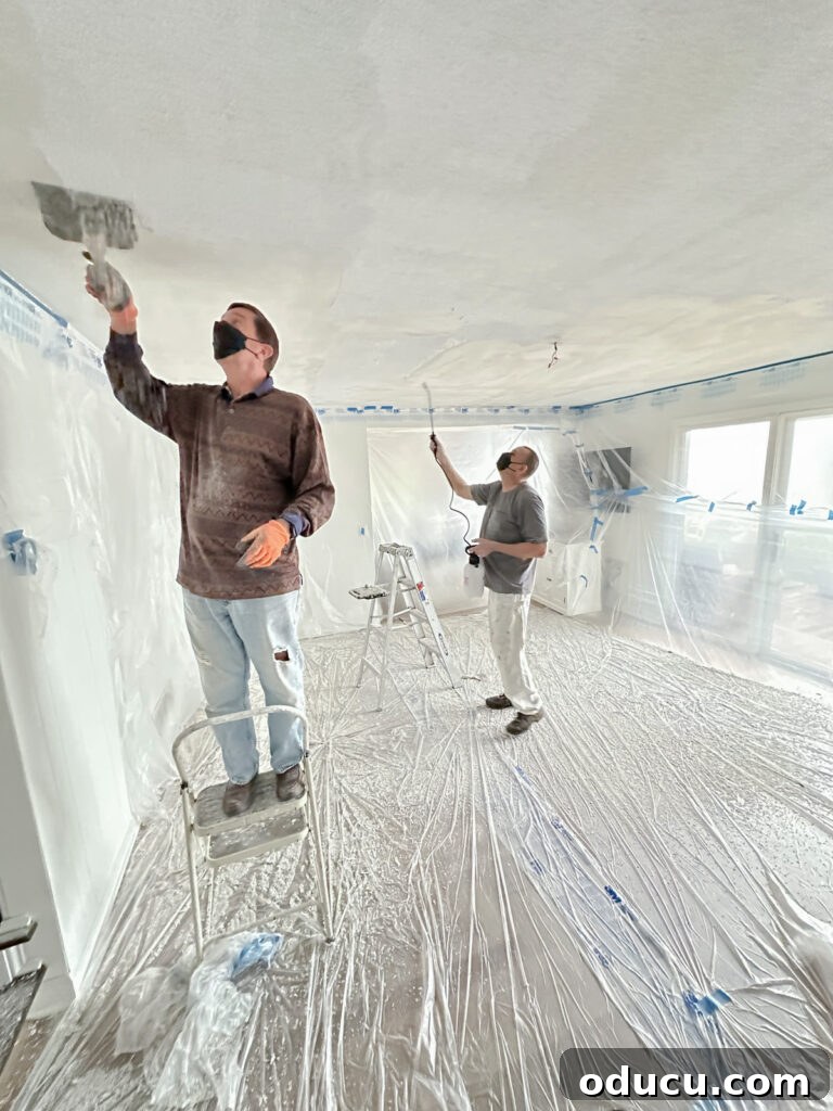 Our Ceiling Contractors Left Us Hanging 3 Homeowner removing popcorn ceiling.