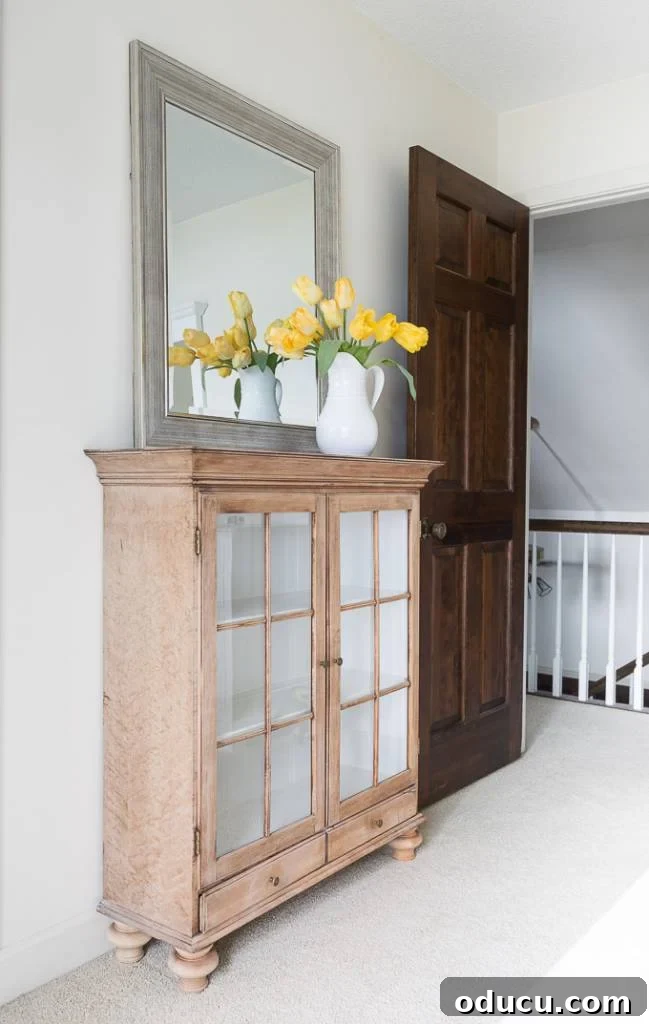 furniture top repurposed into a sideboard. The glass cabinet that was once a top, now stands alone, awaiting its reunion with the base.