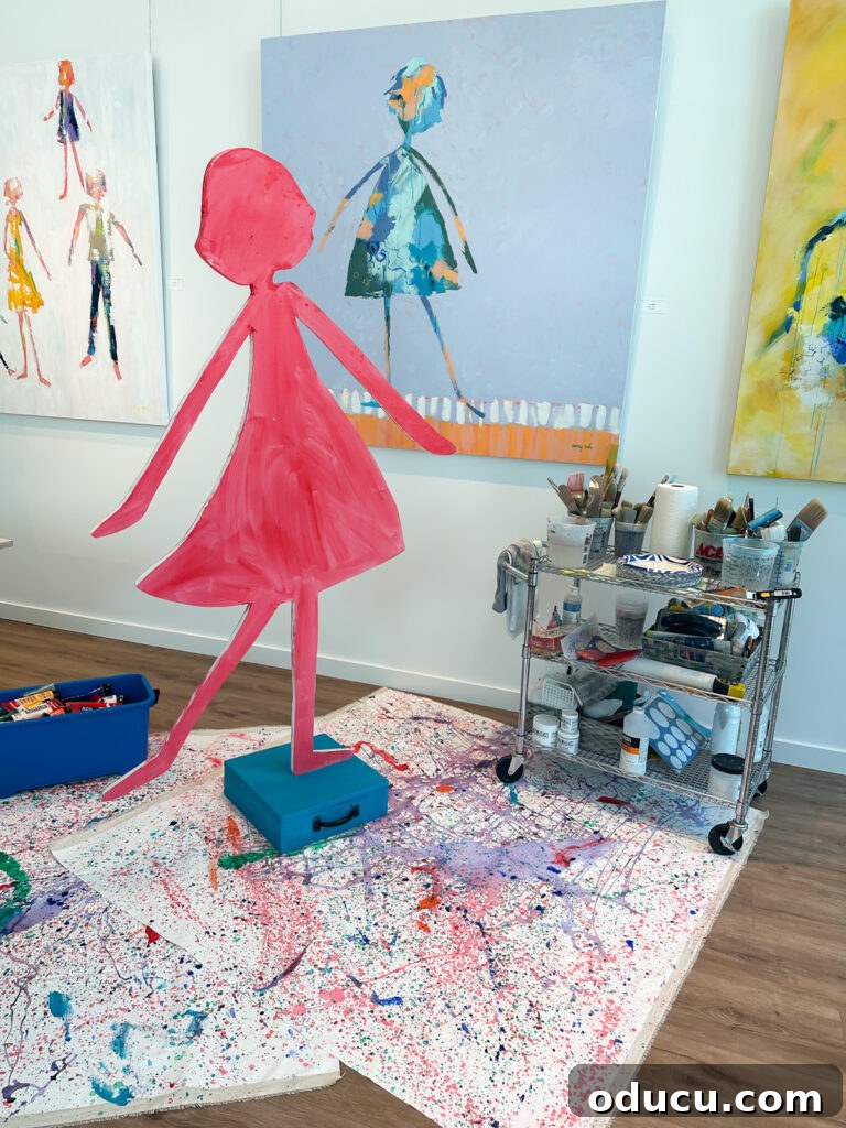 Unlock Your Decor Potential with Craft Paint 6 A close-up of a woman meticulously painting a wood cutout in a female shape, creating a unique piece of home decor art.