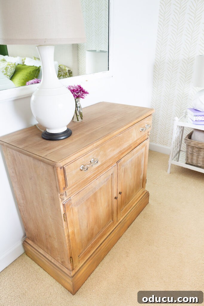 The Transformed Cabinets 11 The newly finished, paint stripped cabinet placed against a wall in a beautifully decorated bedroom