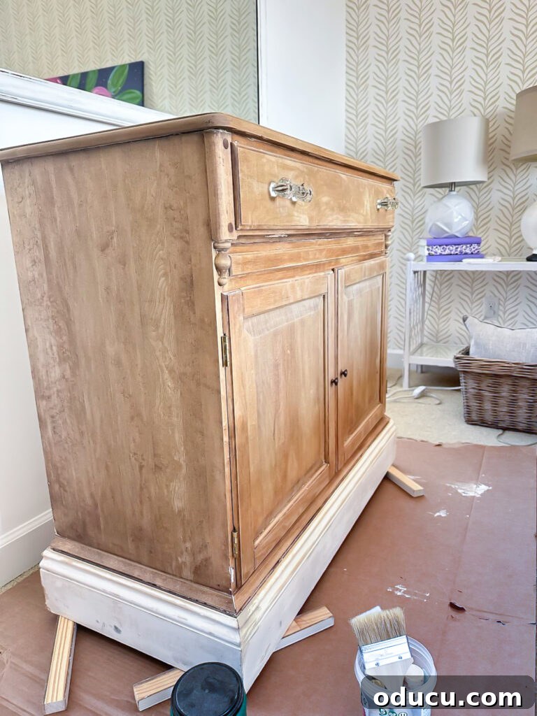 The Transformed Cabinets 5 Close-up of a just paint stripped wood cabinet, showing remaining spots before further treatment