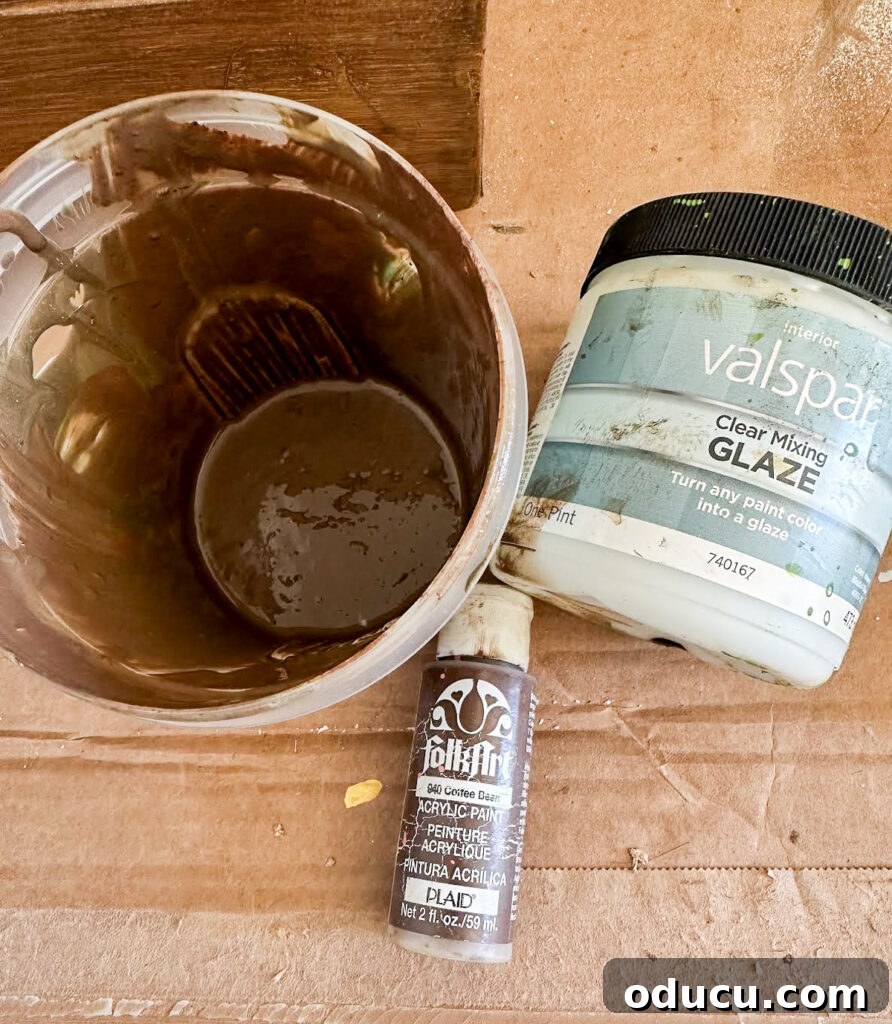 The Transformed Cabinets 8 Mixing brown paint with clear mixing glaze to create a translucent layer for faux wood graining