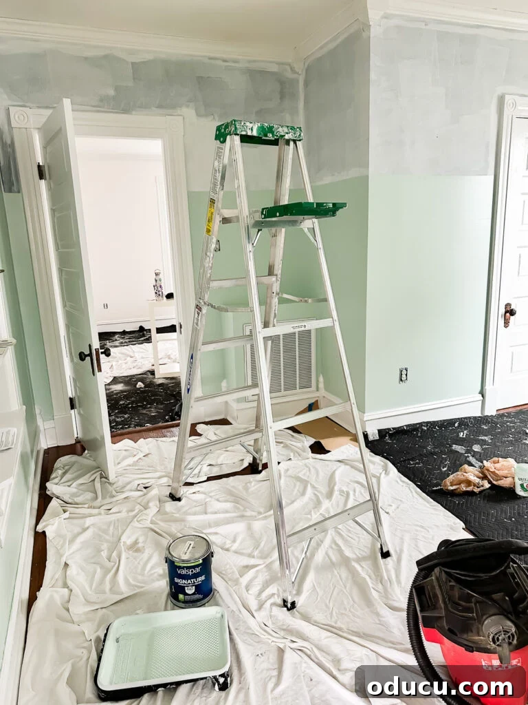 Painting dining room walls with two distinct colors, divided by a planned molding.