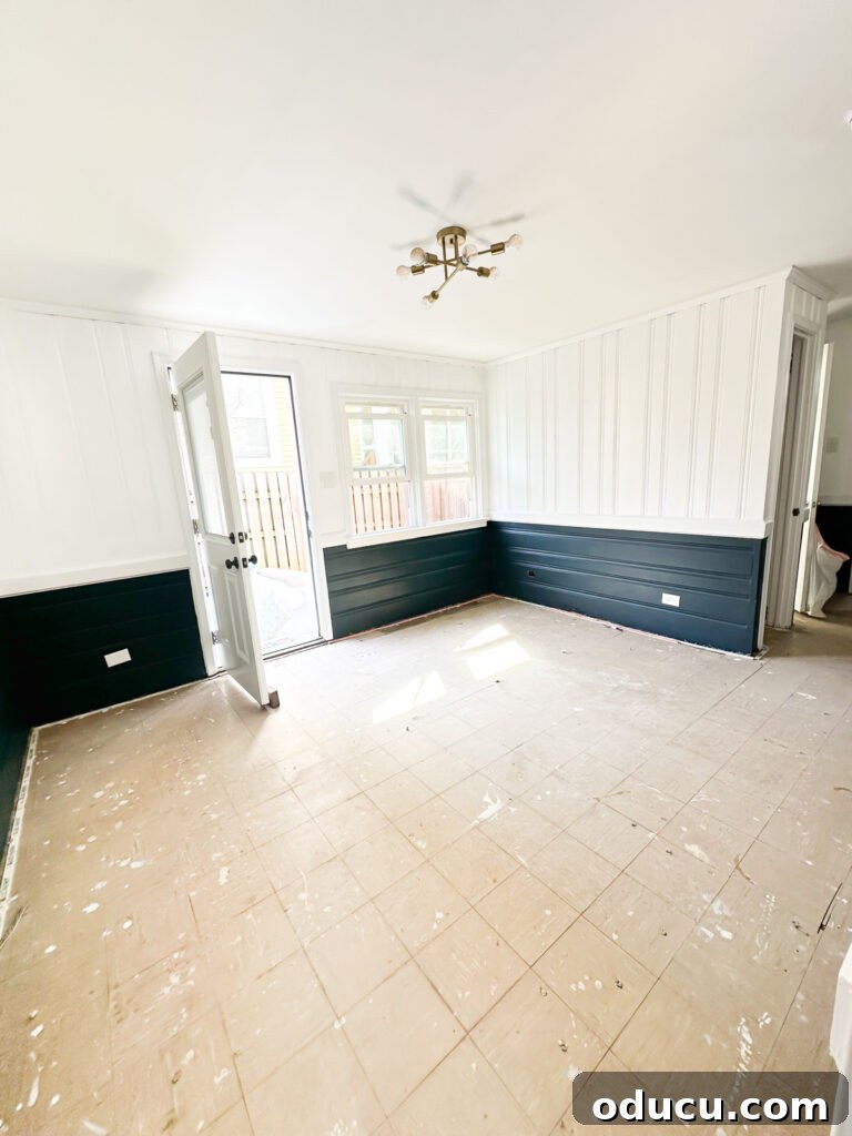 Sunroom after removing old carpet and scrubbing the floor.