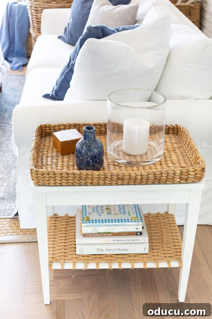 A DIY two-tiered side table contributes to the coastal charm of a living room.