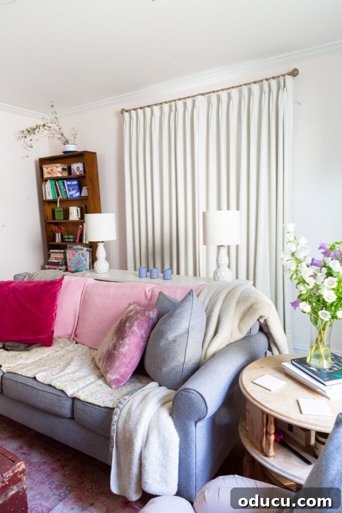 THY Curtains Adorn Every Space Beautifully 19 A comprehensive view of Twopages Ready Made Liz Linen Drapery Pinch Pleat with Blackout Lining in Ivory White (52W x 96L), shown fully closed on a window, emphasizing its blackout effectiveness and sophisticated design.