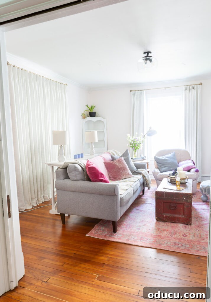 THY Curtains Adorn Every Space Beautifully 20 A wide view looking into the living room, where both windows are elegantly adorned with TwoPages drapes, showcasing the harmonious design.