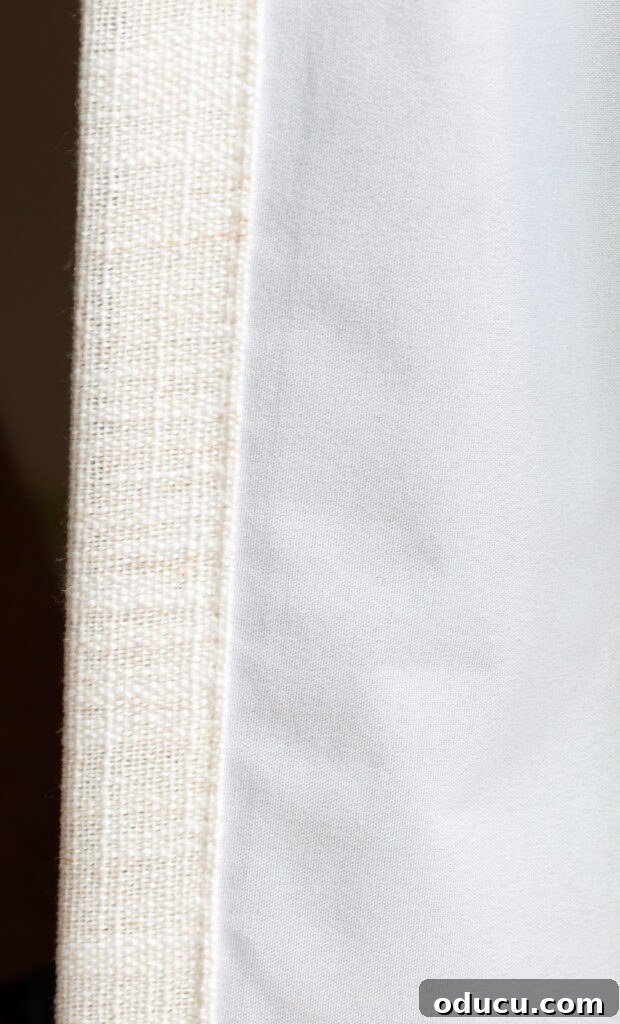THY Curtains Adorn Every Space Beautifully 8 Detailed view of the white/grey blackout lining on the reverse side of the drapery, highlighting its protective quality.