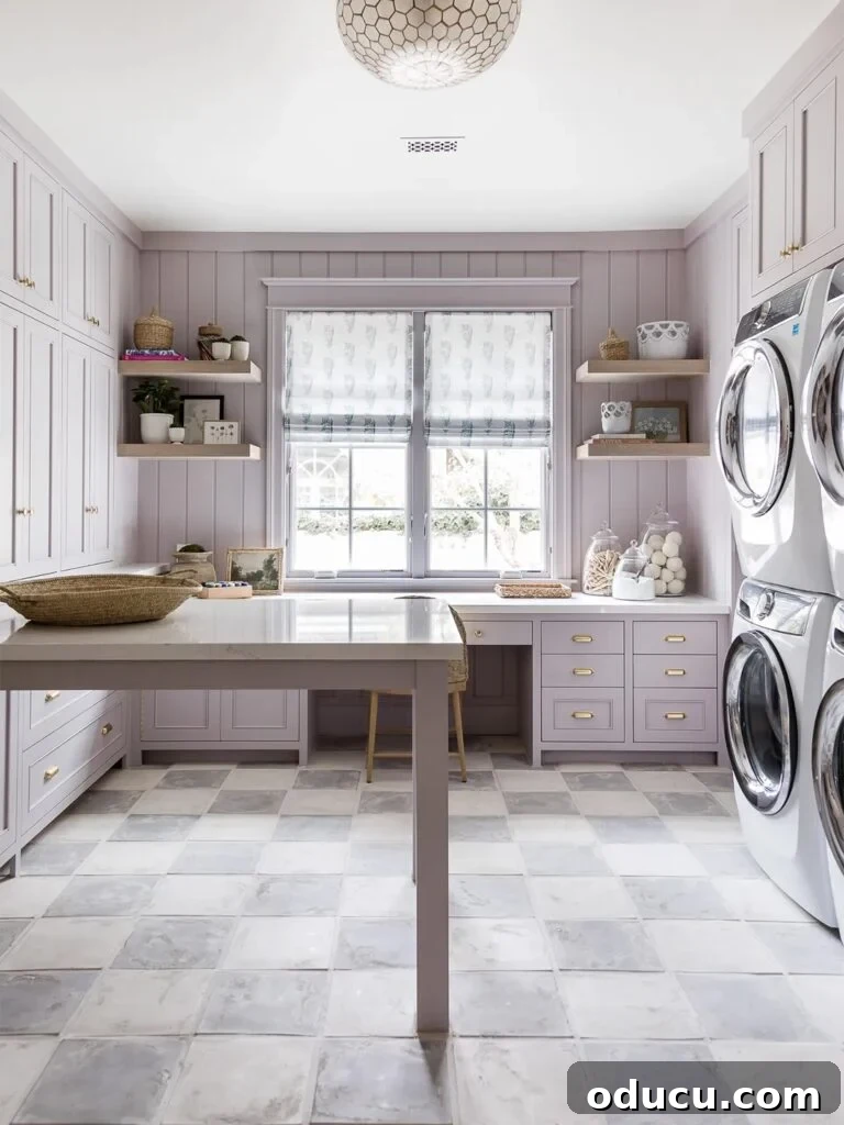 Style Chronicles 250 2 A beautifully designed lilac color laundry room featuring elegant cabinetry and modern appliances, creating a serene and functional space.