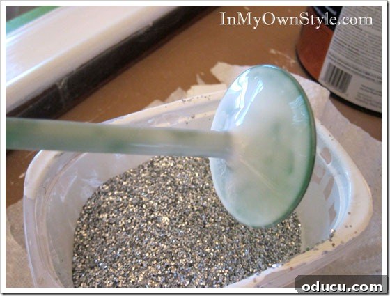 Glue-on-glitter-wine-glass Applying glue to wine glass stem for glitter