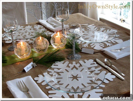 Snowflake-and-glitter-Table Finished Christmas table setting with snowflake placemats and glitter wine glasses