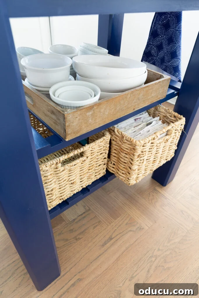 Detailed view of the painted kitchen work table island's shelves, showcasing potential storage options.