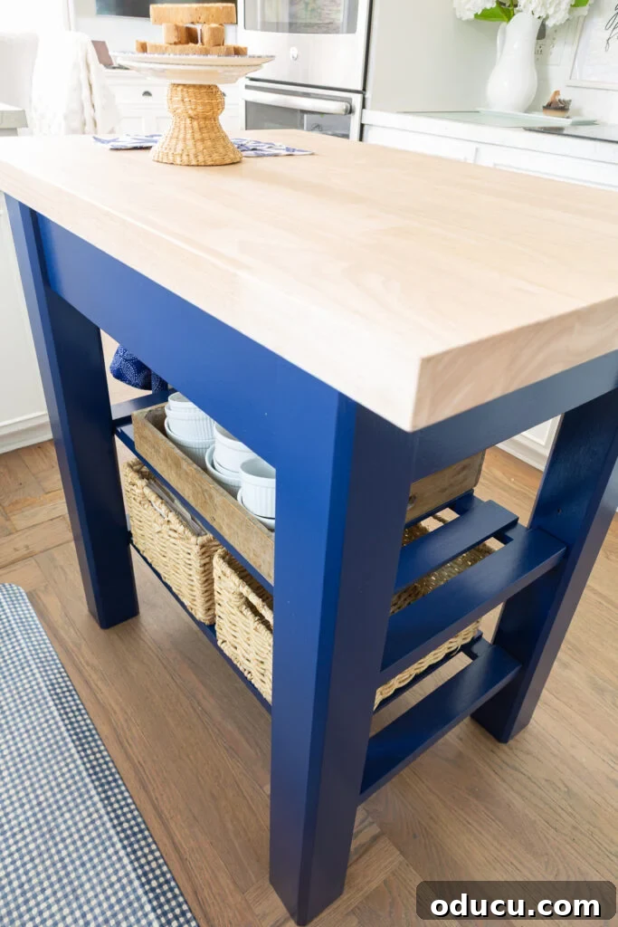 Back side of the painted wood kitchen island, revealing its streamlined design.