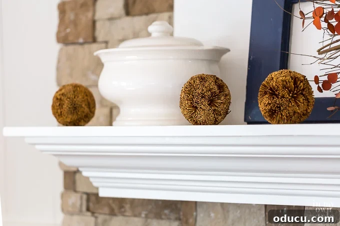 Fall Decor Reimagined 17 3 rustic balls on a white mantel decorated for fall
