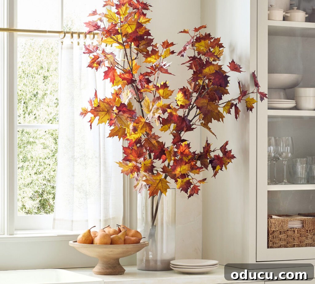 Fall Decor Reimagined 21 faux branches in glass vase on kitchen counter