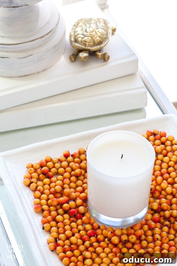 Fall Decor Reimagined 33 Candle on white square tray with orange beans.