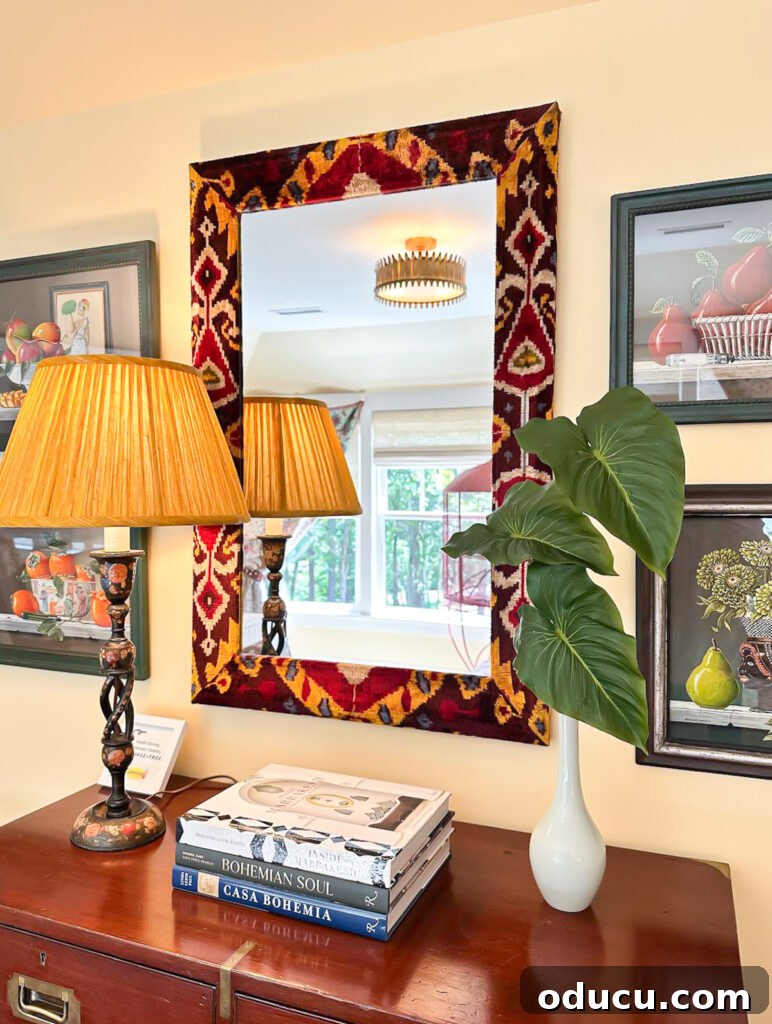 Shaping Tomorrow's Home: Inside the Southern Living Idea House 2025 31 mirror frame covered with fabric in guest room wall