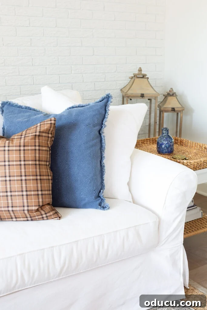 Remember That Essential Decorating Resource 11 3 fall pillows lined up on a white sofa