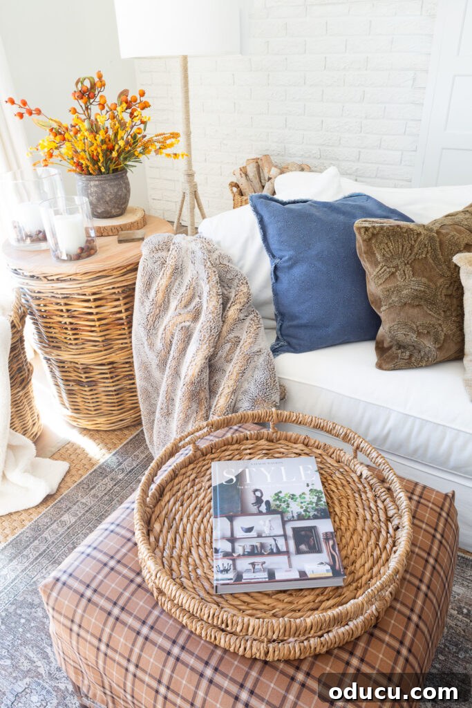 Fall's Full Sensory Home Crafting Your Cozy Autumn Haven 6 A cozy corner in a living room, thoughtfully decorated for fall with soft textiles and warm accents, inviting relaxation and comfort.