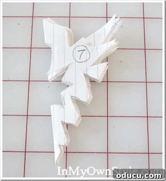 DIY Paper Snowflake Window Displays 12 Diagram illustrating various cutting techniques for paper snowflake designs.