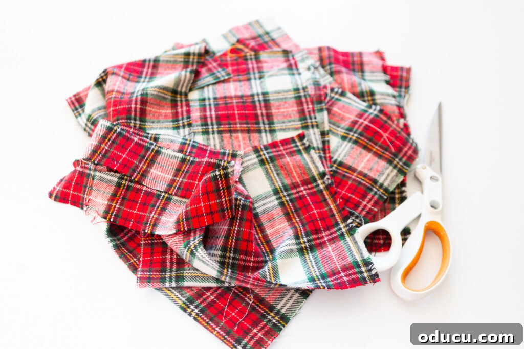 scraps of classic Christmas plaid fabric and a pair of fabric scissors.