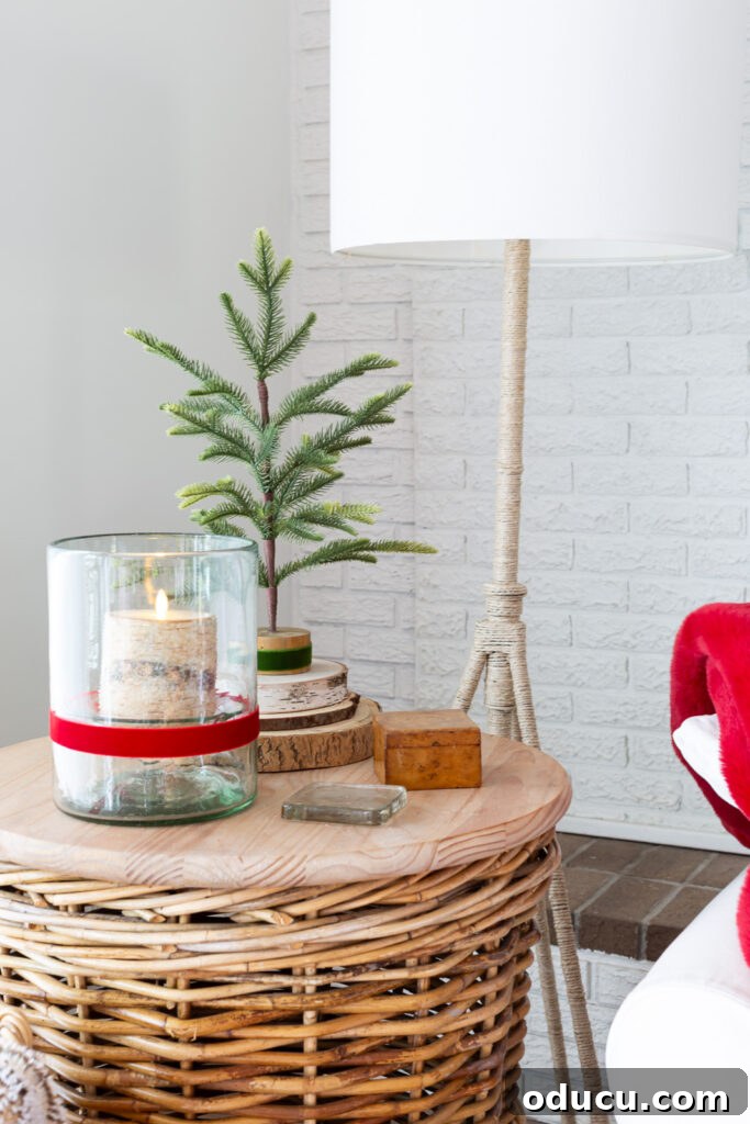 My Christmas Home: Timeless Memories, Not Trends 12 a round wicker basket side table decorated in a simple way for Christmas.