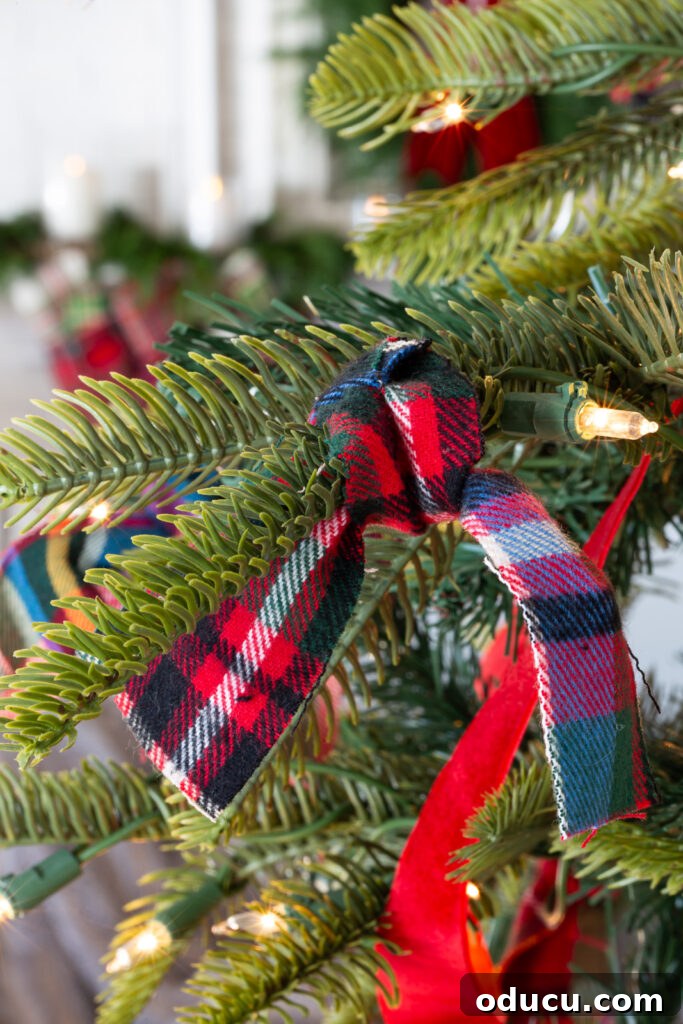 My Christmas Home: Timeless Memories, Not Trends 17 Red plaid flannel fabric strip tied onto a Christmas tree branch.