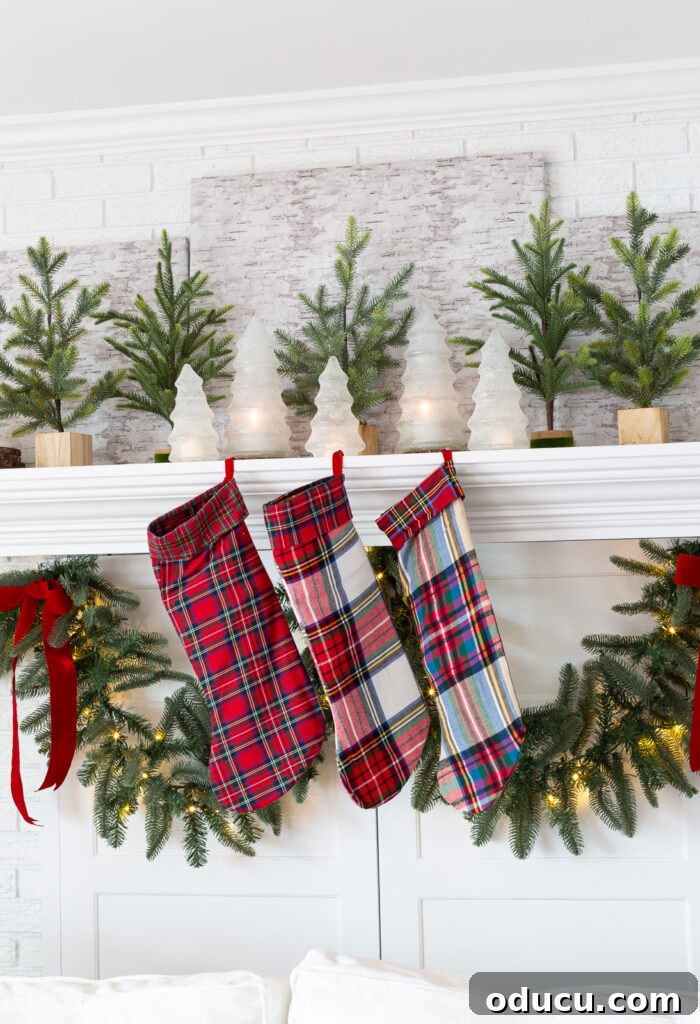 My Christmas Home: Timeless Memories, Not Trends 3 a fireplace mantel decorated for Christmas using green white and red plaid.