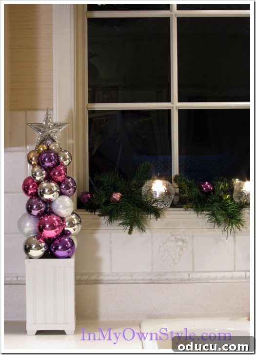 Kitchen Ornament Tree A charming knitting needle ornament Christmas tree proudly displayed on a kitchen counter, adding festive cheer to the culinary space.