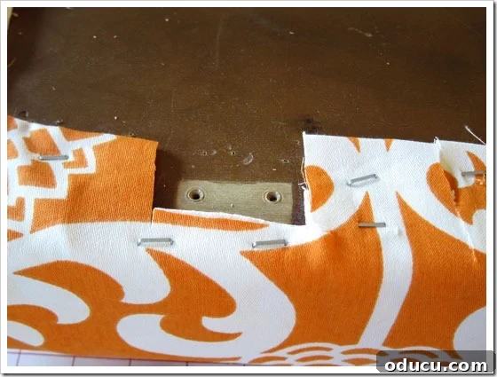 How to customize fabric for furniture with hinges. Cutting away fabric around the hinge area for a seamless reattachment of the bench lid.