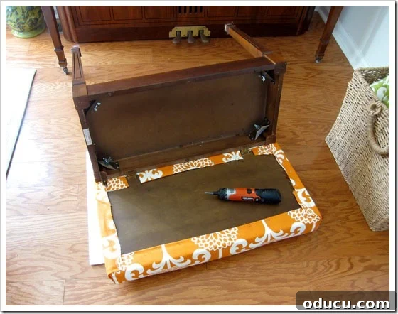 Displaying the completed no-sew piano bench cushion. The fully assembled piano bench with its new no-sew cushion cover in place.