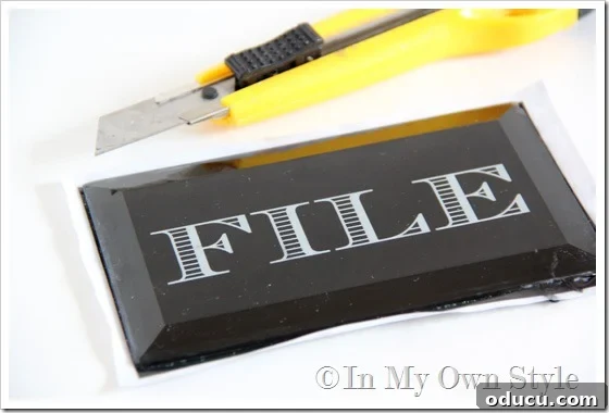 cut excess paper to fit glass for paperweight