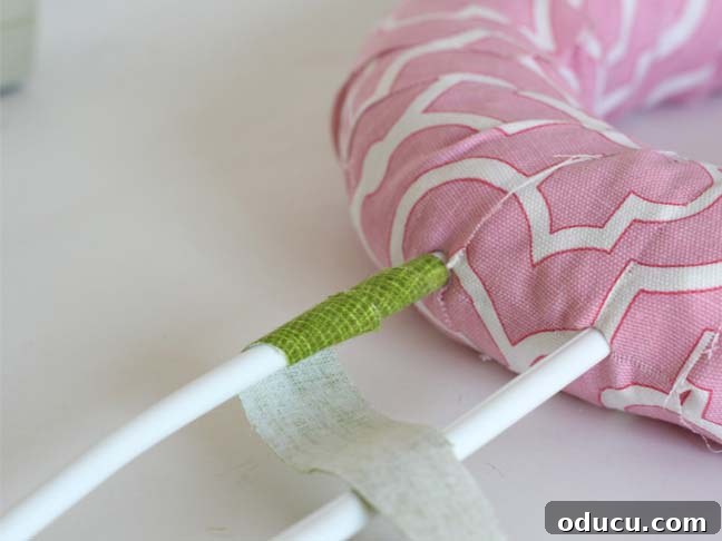 Create a Whimsical Spring Bunny Wreath 10 How to cover plastic hangers to make bunny ears on wreath.