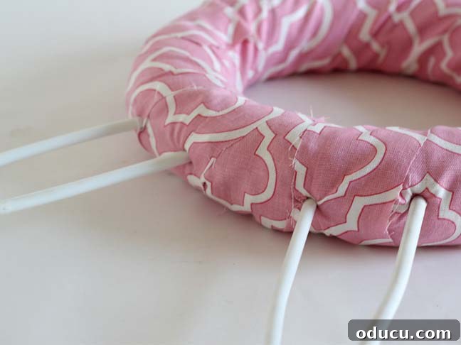 Create a Whimsical Spring Bunny Wreath 8 How to make ears on a bunny wreath using plastic hangers.