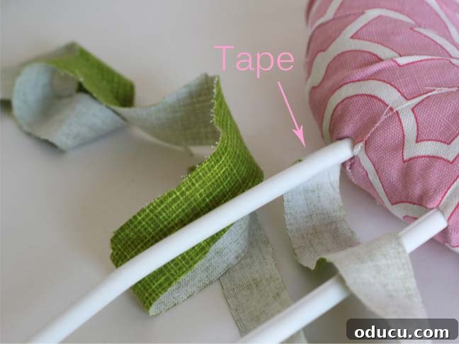 Create a Whimsical Spring Bunny Wreath 9 Scrap fabric wound around plastic hangers to create Easter Bunny ears.