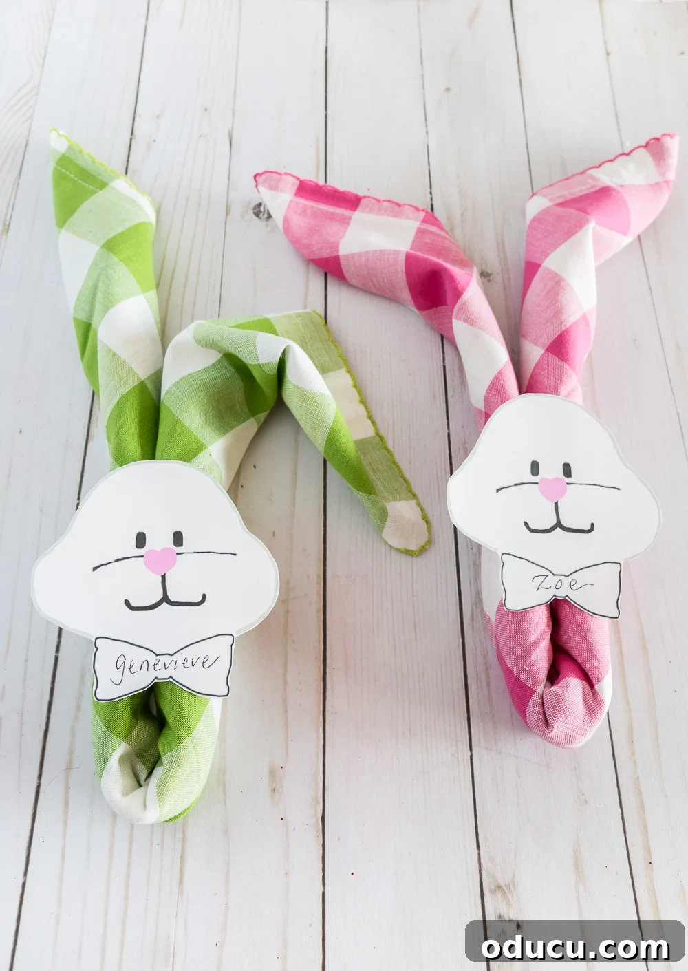 Pastel Buffalo check napkins rolled and placed over rolled napkins with bunny face and bowtie to use as a place card. Pastel Buffalo check napkins rolled and placed over rolled napkins with bunny face and bowtie to use as a place card.