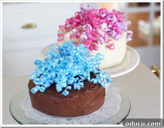 Festive Cakes with Easy Ribbon Decor Two elegantly simple cakes displayed on stands, each exquisitely adorned with the festive curled ribbon toppers, vividly demonstrating their transformative power and ease of application.