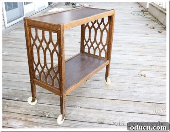 Thrift-Store-Side-Table Old brown thrift store side table with original wheels and worn finish, awaiting a furniture makeover.