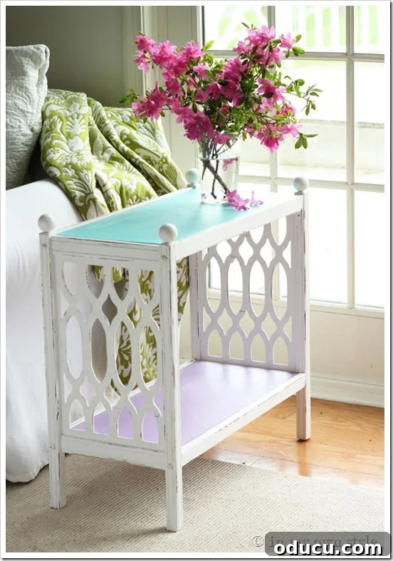 teal-table top on chalk painted thrift store find table makeover White chalk painted side table with a vibrant teal interchangeable top, adorned with pink flowers.
