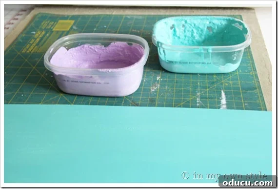 mixing-chalk-paint Mixing DIY chalk paint in a container with a paint stick.