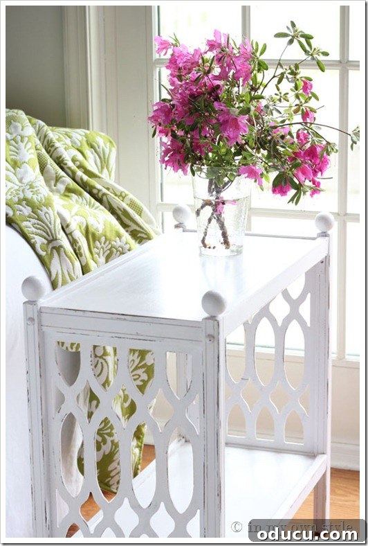 1-shiny-table Shiny white chalk painted side table with elegant details, styled in a living room.