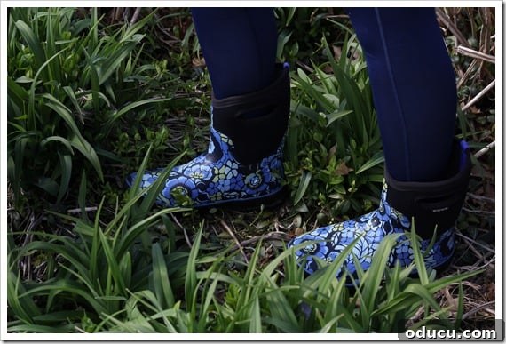Comfort and Durability: A Review of Bogs Boots in Action Woman Wearing Bogs Boots While Working Outdoors