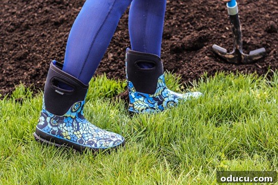 Bogs Footwear and Boots: Ready for Any Backyard Task Daughter Shoveling While Wearing Bogs Footwear
