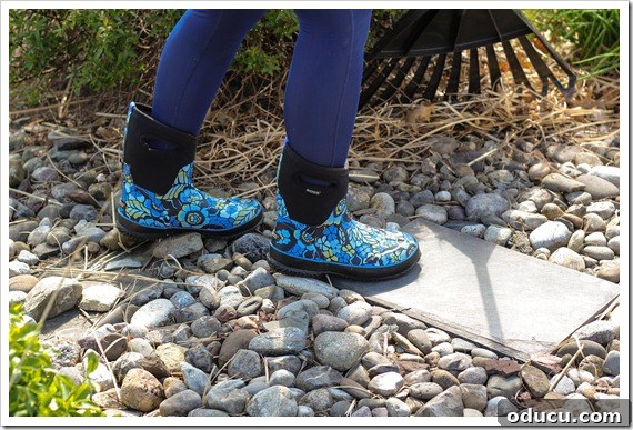 Efficient Backyard Cleanup with Bogs Footwear Daughter Raking Leaves While Wearing Bogs Boots