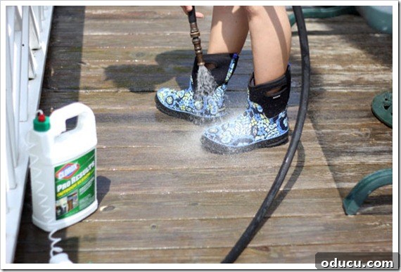 Bogs Waterproof Boots: Essential for Wet Outdoor Cleaning and Gardening Daughter Wearing Bogs Waterproof Boots While Cleaning Deck