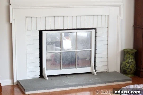 grey concrete fireplace hearth before painting