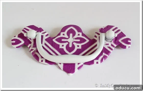 Napkin-coverd-drawer-pull Purple and white patterned Napkin-covered-drawer-pull, close-up finished look