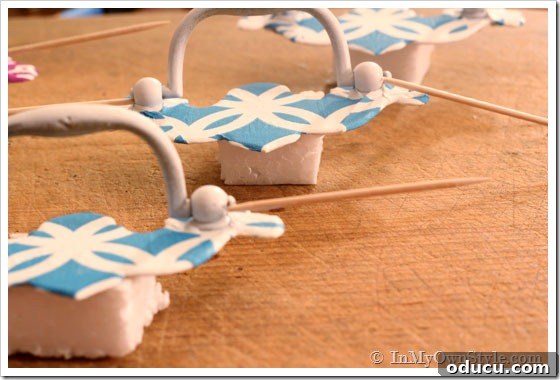 Place-on-blocks Cabinet knob makeovers - how to allow them to dry using toothpicks to hold up the pull.