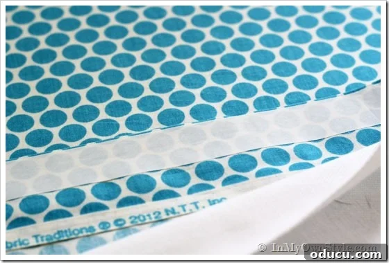 HeatN-bond-Iron-On-adhesive being applied to fabric edges.